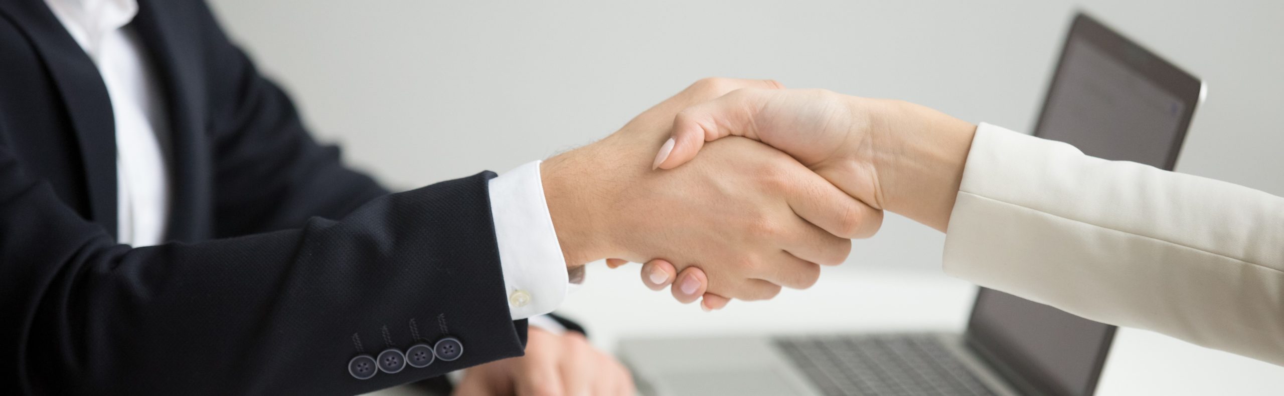 Hr handshaking successful candidate getting hired at new job, closeup